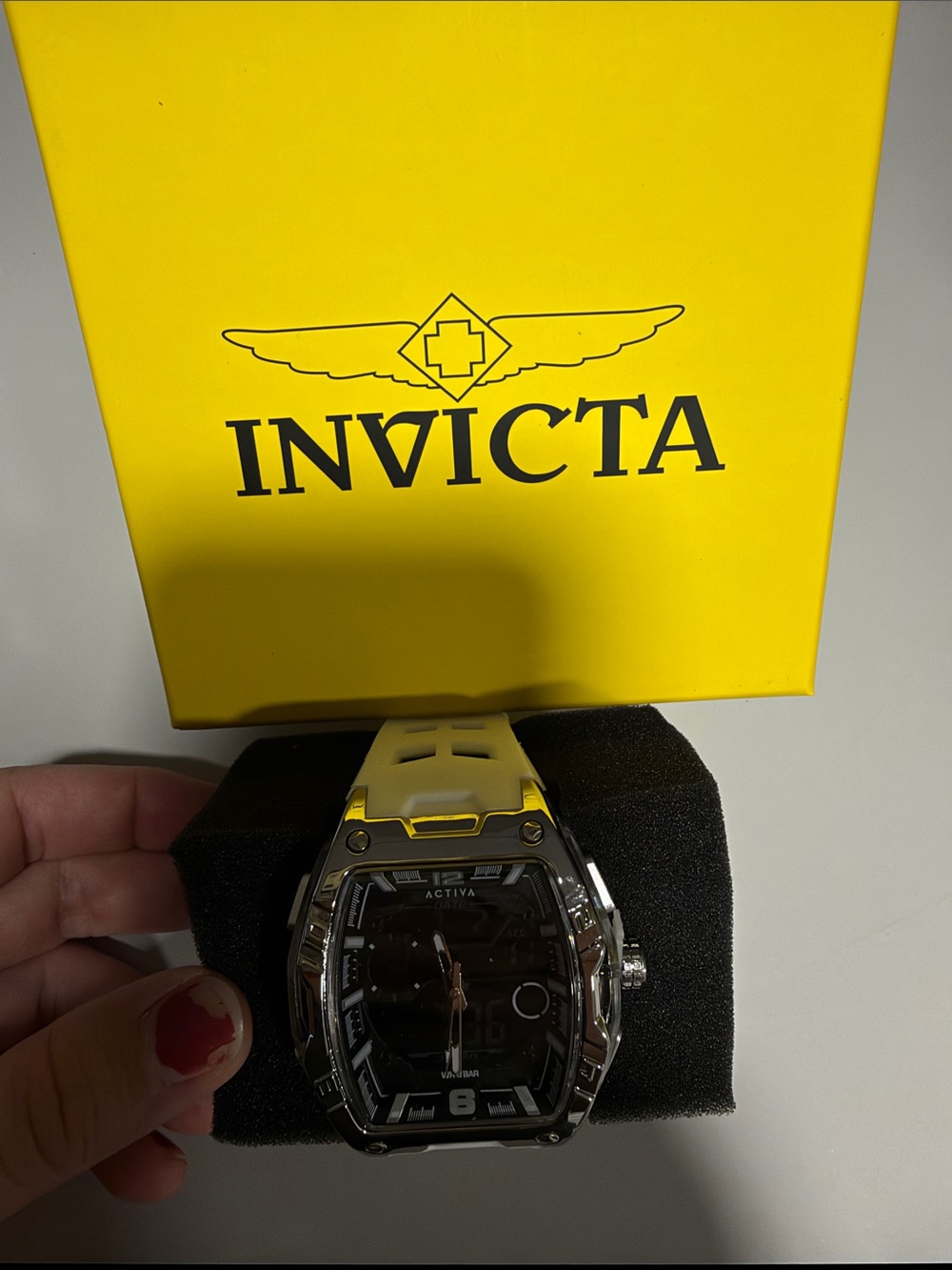 Invicta Silver Case Black Dial Watch with White Strap